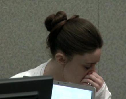 casey anthony trial photos of skull. Casey looks away as she turns